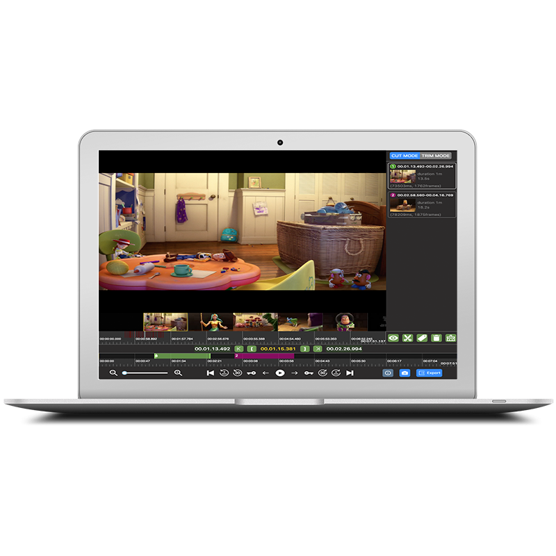 Laptop screen shows a video editing program with a toy-filled playroom video and a timeline of clips beneath it.